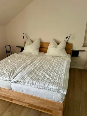 Ein Bett oder Betten in einem Zimmer der Unterkunft Bergzeit Hahnenklee