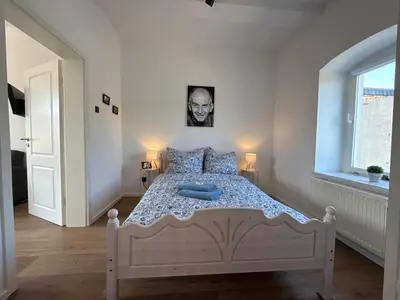 Ein Bett oder Betten in einem Zimmer der Unterkunft Sauna & relaxation in the Harz forest
