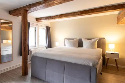 Ein Bett oder Betten in einem Zimmer der Unterkunft Ferienwohnung am Stadtschloss