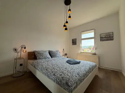 Ein Bett oder Betten in einem Zimmer der Unterkunft Oasis in the heart of the Harz - Sauna