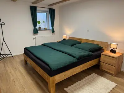 Ein Bett oder Betten in einem Zimmer der Unterkunft Ferienwohnung Hexenruhe