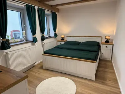 Ein Bett oder Betten in einem Zimmer der Unterkunft Ferienwohnung Hexenruhe