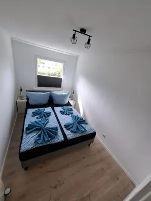 Ein Bett oder Betten in einem Zimmer der Unterkunft Ferienwohnung Balu