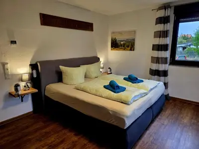 Ein Bett oder Betten in einem Zimmer der Unterkunft Ferienwohnung zum Backstübchen