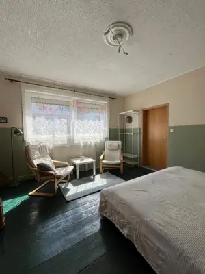 Ein Bett oder Betten in einem Zimmer der Unterkunft Fuchsbau