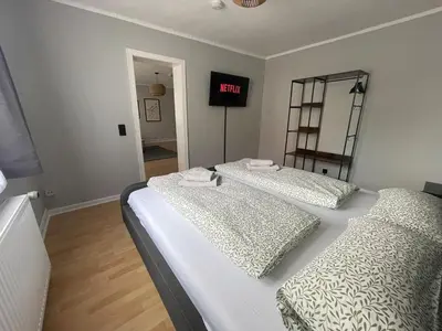 Ein Bett oder Betten in einem Zimmer der Unterkunft Fundis Apartment am Schloss