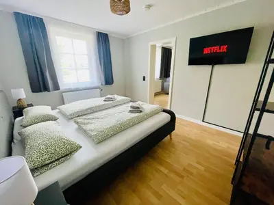 Ein Bett oder Betten in einem Zimmer der Unterkunft Fundis Apartment am Schloss