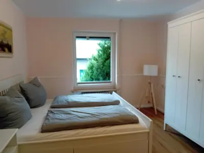 Ein Bett oder Betten in einem Zimmer der Unterkunft Ferienwohnung Calluna