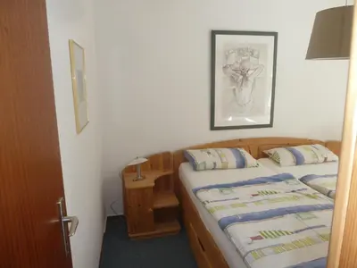 Ein Bett oder Betten in einem Zimmer der Unterkunft Residenz Rosenstraße