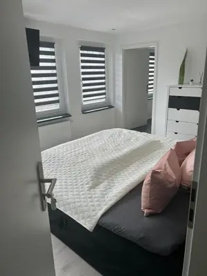 Ein Bett oder Betten in einem Zimmer der Unterkunft Fewo Möösini am Kanonenberg