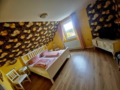 Ein Bett oder Betten in einem Zimmer der Unterkunft CS HARZgeflüster-Das Familienhotel