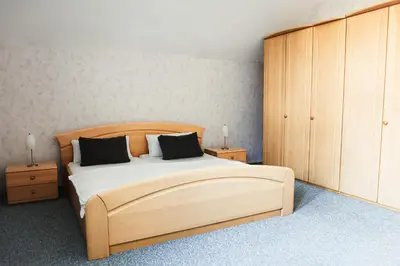 Ein Bett oder Betten in einem Zimmer der Unterkunft Ferienapartments in Schierke am Brocken direkte Wanderweglage