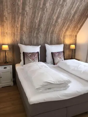 Ein Bett oder Betten in einem Zimmer der Unterkunft Sehnsucht - Harz