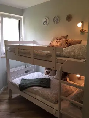 Ein Bett oder Betten in einem Zimmer der Unterkunft Familien-Nest 