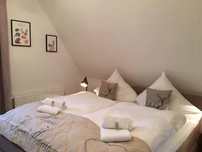 Ein Bett oder Betten in einem Zimmer der Unterkunft Ferienhaus Sehnsucht-Harz 