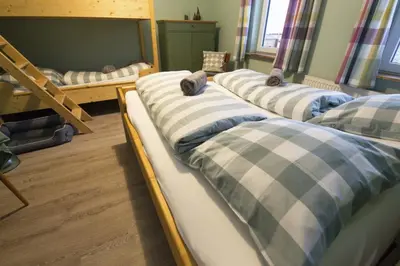 Ein Bett oder Betten in einem Zimmer der Unterkunft Rodelhaus Braunlage