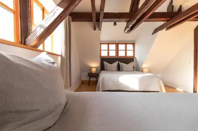 Ein Bett oder Betten in einem Zimmer der Unterkunft Architektenhaus am Pölkentor