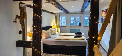 Ein Bett oder Betten in einem Zimmer der Unterkunft Exklusives Altstadthaus mit Schlossblick zentral in Wernigerode