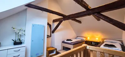 Ein Bett oder Betten in einem Zimmer der Unterkunft Exklusives Altstadthaus mit Schlossblick zentral in Wernigerode