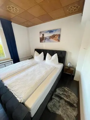 Ein Bett oder Betten in einem Zimmer der Unterkunft HarzRoots mit Garage