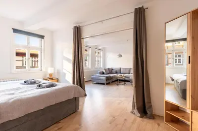Ein Bett oder Betten in einem Zimmer der Unterkunft Ferienwohnung am Nicolaiplatz