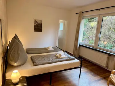 Ein Bett oder Betten in einem Zimmer der Unterkunft FichtenNest Altenau - für 4 Personen und Haustier!