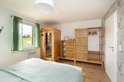 Ein Bett oder Betten in einem Zimmer der Unterkunft FH HarzHirsch - Kamin, Sauna, Bettwäsche, Kurtaxe inklusive