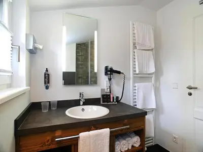 Ein Badezimmer in der Unterkunft Ferienhäuser, Torfhaus