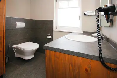 Ein Badezimmer in der Unterkunft Ferienhäuser im Torfhaus Harzresort, Torfhaus