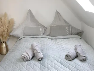 Ein Bett oder Betten in einem Zimmer der Unterkunft Heimat Goslar Apartments 