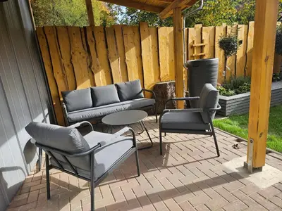 Ein Patio oder anderer Außenbereich in der Unterkunft Ferienwohnung am Wald mit Garten