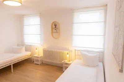 Ein Bett oder Betten in einem Zimmer der Unterkunft Harter Brocken Tatort Apartment 2 Einheiten