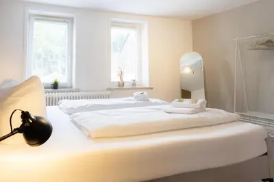 Ein Bett oder Betten in einem Zimmer der Unterkunft Harter Brocken Tatort Apartment 2 Einheiten