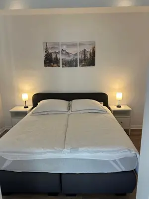 Ein Bett oder Betten in einem Zimmer der Unterkunft Ferienwohnung Mauerperle