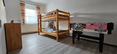 Ein Bett oder Betten in einem Zimmer der Unterkunft Ferienhaus Rosengarten