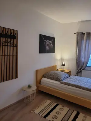 Ein Bett oder Betten in einem Zimmer der Unterkunft Fewo Langenstein