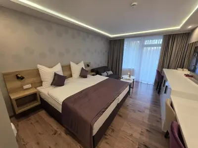 Ein Bett oder Betten in einem Zimmer der Unterkunft TeMax Lux Hahnenklee