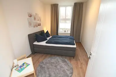 Ein Bett oder Betten in einem Zimmer der Unterkunft Gästewohnung 