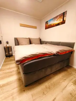 Ein Bett oder Betten in einem Zimmer der Unterkunft Komfortabler Bungalow Am Schlosswald mit privater Sauna&Terrasse - Wernigerode Harz