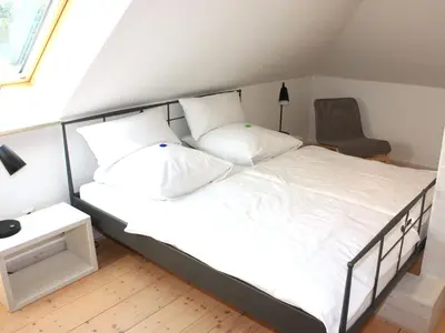 Ein Bett oder Betten in einem Zimmer der Unterkunft Apartment Wohlfühloase für Natur- und Gartenliebhaber by Interhome