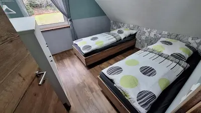 Ein Bett oder Betten in einem Zimmer der Unterkunft Ferienhaus Burgblick in Blankenburg Harz Familie Bielenski