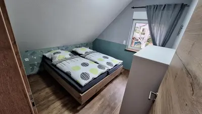 Ein Bett oder Betten in einem Zimmer der Unterkunft Ferienhaus Burgblick in Blankenburg Harz Familie Bielenski