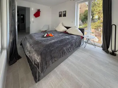 Ein Bett oder Betten in einem Zimmer der Unterkunft Designapartments Sportivo Maserati - Sennhütte 6