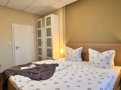 Ein Bett oder Betten in einem Zimmer der Unterkunft Ferienwohnung 