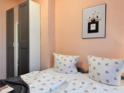Ein Bett oder Betten in einem Zimmer der Unterkunft Ferienwohnung 