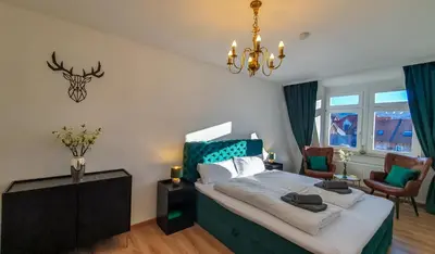 Ein Bett oder Betten in einem Zimmer der Unterkunft Premium Apartment mit Schlossblick zentral am Bahnhof Wernigerode