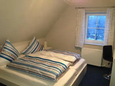 Ein Bett oder Betten in einem Zimmer der Unterkunft Ferienwohnung Hellerling