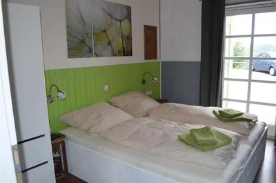 Ein Bett oder Betten in einem Zimmer der Unterkunft Ferienwohnungen Haus Auszeit