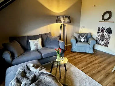 Ein Sitzbereich in der Unterkunft Ferienwohnung Auszeit früher Harz-Momente Bruchberg