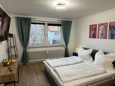 Ein Bett oder Betten in einem Zimmer der Unterkunft Ferienwohnung Bergwurm mit Balkon